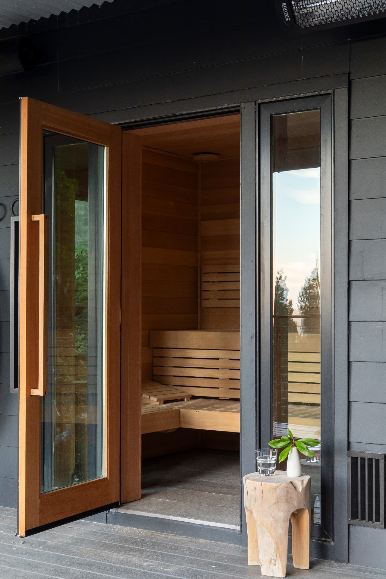 Cedar sauna with a glass door
